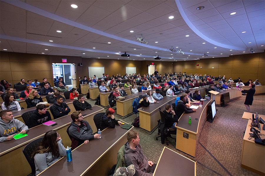 Communication majors holding class in Timmerman Auditorium