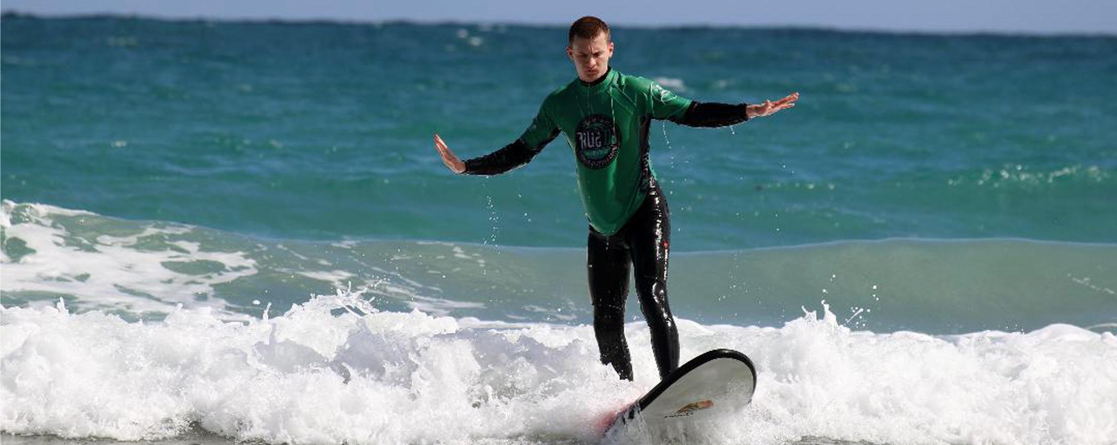 A person surfing in the ocean.